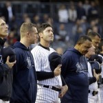 New York Yankees catcher Francisco Cervelli looks up following a moment of silence for victims of the Boston Marathon explosions before a baseball game against the Arizona Diamondbacks at Yankee Stadium in New York, Tuesday, April 16, 2013. (AP Photo/Kathy Willens)