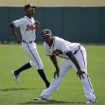 Atlanta Braves outfielders Justin Upton, right, and his brother B.J. Upton, left, stretch before an exhibition baseball game against the Detroit Tigers Friday, Feb. 22, 2013, in Kissimmee, Fla. (AP Photo/David J. Phillip)