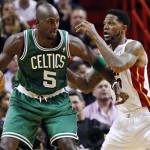 Boston Celtics' Kevin Garnett (5) backs down Miami Heat's Udonis Haslem (40) during the first half of their NBA basketball game, Tuesday, Oct. 30, 2012, in Miami. (AP Photo/J Pat Carter)