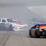 Johanna Long, left, spins form a collision with Alex Bowman, right rear, and Jamie Dick, right front, on the front stretch on the second lap during the NASCAR Nationwide Series auto race Saturday, March 2, 2013, at Phoenix International Raceway in Avondale, Ariz. (AP Photo/Paul Connors)