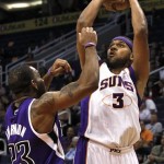 Phoenix Suns' Jared Dudley (3) shoots over Sacramento Kings' Marcus Thornton (23) during the second half in a preseason NBA basketball game, Monday, Oct. 22, 2012, in Phoenix. The Suns won 103-88. (AP Photo/Ross D. Franklin)