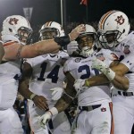  Auburn's Tre Mason is congratulated by teammates after his touchdown run during the second half of the NCAA BCS National Championship college football game against Florida State Monday, Jan. 6, 2014, in Pasadena, Calif. (AP Photo/David J. Phillip)