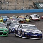 Mark Martin (55) and Kasey Kahne (5) lead the field out of Turn 4 at the start of the NASCAR Sprint Cup Series auto race, Sunday, March 3, 2013, in Avondale, Ariz. (AP Photo/Ross D. Franklin)