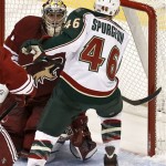Minnesota Wild's Jared Spurgeon (46) scores on Phoenix Coyotes goaltender Mike Smith, left, during the second period in an NHL hockey game, Thursday, Feb. 28, 2013, in Glendale, Ariz. (AP Photo/Ross D. Franklin)