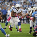 Indianapolis Colts running back Trent Richardson, center, runs upfield against the San Diego Chargers during the first half of an NFL football game Monday, Oct. 14, 2013, in San Diego. (AP Photo/Denis Poroy)