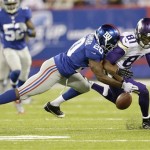 New York Giants cornerback Prince Amukamara (20) breaks up a pass to Minnesota Vikings' Jerome Simpson (81) during the first half of an NFL football game Monday, Oct. 21, 2013 in East Rutherford, N.J. (AP Photo/Julio Cortez)
