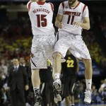 Louisville's Luke Hancock (11) and Louisville's Tim Henderson reacts to play against Wichita State during the second half of the NCAA Final Four tournament college basketball semifinal game Saturday, April 6, 2013, in Atlanta. (AP Photo/John Bazemore)
