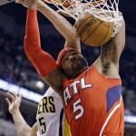Atlanta Hawks forward Josh Smith (5) dunks under Indiana Pacers forward Gerald Green in the first half of Game 2 of a first-round NBA basketball playoff series in Indianapolis, Wednesday, April 24, 2013. (AP Photo/Michael Conroy)