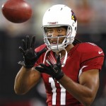 Arizona Cardinals wide receiver Larry Fitzgerald warms up prior to a preseason NFL football game against the Oakland Raiders, Friday, Aug. 17, 2012, in Glendale, Ariz. (AP Photo/Matt York)
