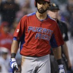 Puerto Rico's Angel Pagan walks to the dugout after striking out against Dominican Republic's Samuel Deduno during the fifth inning of the championship game of the World Baseball Classic in San Francisco, Tuesday, March 19, 2013. (AP Photo/Eric Risberg)