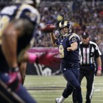 St. Louis Rams quarterback Sam Bradford, right, throws a 7-yard touchdown pass to tight end Lance Kendricks, left, during the first quarter of an NFL football game against the Arizona Cardinals, Thursday, Oct. 4, 2012, in St. Louis. (AP Photo/Tom Gannam)