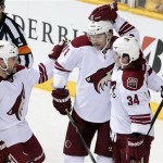  Phoenix Coyotes forward Tim Kennedy (34) celebrates with Derek Morris (53) and Martin Hanzal (11), of the Czech Republic, after Kennedy scored against the Nashville Predators in the second period of an NHL hockey game Monday, Nov. 25, 2013, in Nashville, Tenn. (AP Photo/Mark Humphrey)