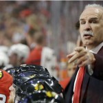 Chicago Blackhawks head coach Joel Quenneville points as he talks to his team during the second period of an NHL hockey game against the Washington Capitals, Tuesday, Oct. 1, 2013, in Chicago. (AP Photo/Nam Y. Huh)
