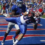 Louisiana Tech running back Hunter Lee (36) makes a touchdown catch while covered by Kansas safety Isaiah Johnson, back, during the first half of an NCAA college football game in Lawrence, Kan., Saturday, Sept. 21, 2013. (AP Photo/Orlin Wagner)