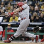 St. Louis Cardinals' Matt Holliday swings on a home run that scored Carlos Beltran in the sixth inning of Game 4 of a National League baseball division series against the Pittsburgh Pirates on Monday, Oct. 7, 2013, in Pittsburgh. (AP Photo/Gene J. Puskar)