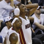 Miami Heat center Chris Bosh, right and Miami Heat small forward LeBron James react in the closing moments of the second half of Game 1 of the NBA Finals basketball game against the San Antonio Spurs, Thursday, June 6, 2013 in Miami. (AP Photo/Wilfredo Lee)