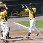 Pittsburgh Pirates's Starling Marte, right, celebrates with teammate Ivan De Jesus Jr. after hitting a home run during a baseball spring training intrasquad game, Friday, Feb. 22, 2013, in Bradenton, Fla. (AP Photo/Charlie Neibergall)