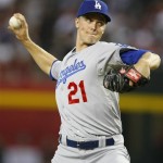 Los Angeles Dodgers starting pitcher Zack Greinke (21) throws against the Arizona Diamondbacks in the first inning during a baseball game on Monday, July 8, 2013, in Phoenix. (AP Photo/Rick Scuteri)