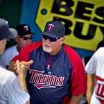 Minnesota Twins manager Ron Gardenhire, center, fist bumps Justin Morneau, left, before the start of an exhibition spring training baseball game against the Philadelphia Phillies, Wednesday, Feb. 27, 2013, in Fort Myers, Fla. After a lengthy tenure in Minnesota, Gardenhire enters the last year of his contract, and he's not the only manager under pressure to win this season. Don Mattingly of the Dodgers, Joe Girardi of the Yankees and Charlie Manuel of the Phillies could all be out of a job if their teams don't perform. (AP Photo/David Goldman)