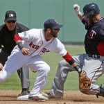 Boston Red Sox second baseman Dustin Pedroia loses the ball as Minnesota Twin's Ryan Doumit doubles in the second inning of a spring training baseball game in Fort Myers, Fla., Monday, March 19, 2012. (AP Photo/Charles Krupa)