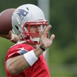 New England Patriots quarterback Tim Tebow throws during a team football practice in Foxborough, Mass., Tuesday June 11, 2013. (AP Photo/Charles Krupa)