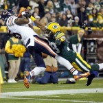 Chicago Bears' Brandon Marshall catches a touchdown pass with Green Bay Packers' Tramon Williams (38) covering during the first half of an NFL football game Monday, Nov. 4, 2013, in Green Bay, Wis. (AP Photo/Jeffrey Phelps)