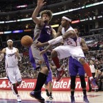 Los Angeles Clippers' Mo Williams, right, passes the ball as he is defended by Phoenix Suns' Robin Lopez during the second half of an NBA basketball game in Los Angeles, Thursday, March 15, 2012. The Suns won 91-87. (AP Photo/Jae C. Hong)