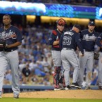 Atlanta Braves starting pitcher Julio Teheran, left, leaves the game against the Los Angeles Dodgers during the third inning of Game 3 of the National League division baseball series Sunday, Oct. 6, 2013, in Los Angeles. (AP Photo/Mark J. Terrill)