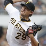 Pittsburgh Pirates starting pitcher Kevin Correia throws to an Arizona Diamondbacks batter in the first inning of a baseball game Wednesday, Aug. 8, 2012, in Pittsburgh. (AP Photo/Keith Srakocic)