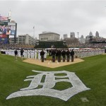 Umpires line up as they keep a spot to honor umpire Wally Bell, who died Monday of a heart attack, during the national anthem before Game 3 of the American League baseball championship series between the Detroit Tigers and the Boston Red Sox, Tuesday, Oct. 15, 2013, in Detroit. (AP Photo/Matt Slocum)