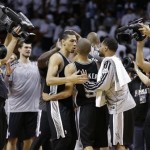 San Antonio Spurs shooting guard Danny Green (4), left, reacts with San Antonio Spurs point guard Tony Parker (9) during the second half of Game 1 of the NBA Finals basketball game, Thursday, June 6, 2013 in Miami. The Spurs defeated the Heat 92-88. (AP Photo/Lynne Sladky)