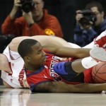 Mississippi guard Jarvis Summers (32) gathers a loose ball in front of Wisconsin center Jared Berggren (40) during the first half of a second-round game in the NCAA college basketball tournament at the Sprint Center in Kansas City, Mo., Friday, March 22, 2013. (AP Photo/Orlin Wagner)
