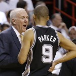 San Antonio Spurs head coach Gregg Popovich speaks to guard Tony Parker (9) during a time out during the first half of Game 6 of the NBA Finals basketball game against the Miami Heat, Tuesday, June 18, 2013 in Miami. (AP Photo/Lynne Sladky)