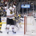 Chicago Blackhawks left wing Brandon Saad, center, celebrates a goal by Chicago Blackhawks center Michal Handzus, right, of Slovakia, in front of Boston Bruins defenseman Zdeno Chara (33), of Slovakia, during the first period in Game 4 of the NHL hockey Stanley Cup Finals, Wednesday, June 19, 2013, in Boston. (AP Photo/Elise Amendola)