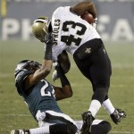 Philadelphia Eagles' Cary Williams (26) pulls down New Orleans Saints' Darren Sproles (43) by his collar during the second half of an NFL wild-card playoff football game, Saturday, Jan. 4, 2014, in Philadelphia. Williams was penalized for the tackle. (AP Photo/Matt Rourke)