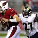 St. Louis Rams free safety Quintin Mikell (27) hurries Arizona Cardinals quarterback Ryan Lindley (14) during the second half of an NFL football game, Sunday, Nov. 25, 2012, in Glendale, Ariz. (AP Photo/Paul Connors)