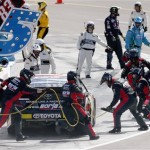  The pit crew of Ryan Truex works on his car during the NASCAR Sprint Cup Series auto race Sunday, March 2, 2014, in Avondale, Ariz. (AP Photo/Ross D. Franklin)