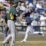 Oakland Athletics' Jesse Chavez reacts after giving up a home run to Milwaukee Brewers' Ryan Braun during the first inning of an exhibition spring training baseball game Saturday, Feb. 23, 2013, in Phoenix. (AP Photo/Morry Gash)
