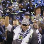 Seattle Seahawks quarterback Russell Wilson holds up the Lombardi Trophy after winning the NFL Super Bowl XLVIII football game against the Denver Broncos, Sunday, Feb. 2, 2014, in East Rutherford, N.J. The Seahawks won 43-8. (AP Photo/Chris O'Meara)