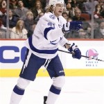 Tampa Bay Lightning center Steven Stamkos celebrates after scoring a goal against the Phoenix Coyotes in the first period of an NHL hockey game on Saturday, Jan. 21, 2012, in Glendale, Ariz. (AP Photo/Paul Connors)