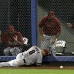 Arizona Diamondbacks' Gerardo Parra lies in the outfield after being injured while trying to catch a ball hit for a triple by New York Mets' Omar Quintanilla during the eighth inning of the baseball game at Citi Field, Monday, July 1, 2013, in New York. (AP Photo/Seth Wenig)