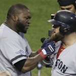  Boston Red Sox's David Ortiz pulls on the beard of Mike Napoli after Napoli hits a home run in the seventh inning during Game 3 of the American League baseball championship series against the Detroit Tigers Tuesday, Oct. 15, 2013, in Detroit. (AP Photo/Carlos Osorio)