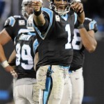 Carolina Panthers' Cam Newton (1) celebrates after a first down against the New England Patriots during the second half of an NFL football game in Charlotte, N.C., Monday, Nov. 18, 2013. (AP Photo/Mike McCarn)