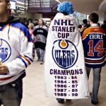 Edmonton Oilers fans make their way to their seats in Edmonton, Alberta, on Tuesday, Oct. 1, 2013, before the Oilers' NHL hockey game against the Winnipeg Jets. (AP Photo/The Canadian Press, Jason Franson)
