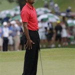Tiger Woods reacts after missing a par putt on the seventh green during the fourth round of the Masters golf tournament Sunday, April 14, 2013, in Augusta, Ga. (AP Photo/David J. Phillip)