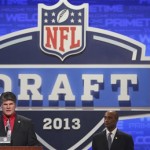 Former Kansas City Chiefs defensive back Gary Barbaro, left, announces an NFL football draft pick during the second round on Friday, April 26, 2013, at Radio City Music Hall in New York. (AP Photo/Mary Altaffer)