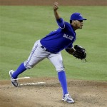 Toronto Blue Jays pitcher Esmil Rogers delivers a pitch against the Arizona Diamondbacks during the first inning of a baseball game, Monday, Sept. 2, 2013, in Phoenix. (AP Photo/Matt York)