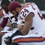  Virginia Tech's Tariq Edwards, foreground, and teammates sit dejectedly on the bench as time runs out at the NCAA college football Sun Bowl game Tuesday Dec. 31, 2013 in El Paso, Texas. (AP Photo/Victor Calzada)
