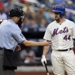 New York Mets' John Buck (44) looks at home plate umpire Mike Everitt after striking out with the bases loaded to end the first inning of the baseball game against the Arizona Diamondbacks at Citi Field, Monday, July 1, 2013, in New York. (AP Photo/Seth Wenig)