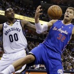 Los Angeles Clippers' Blake Griffin (32) reaches for a rebound in front of Memphis Grizzlies' Darrell Arthur (00) during the first half of Game 6 in a first-round NBA basketball playoff series in Memphis, Tenn., Friday, May 3, 2013. (AP Photo/Danny Johnston)